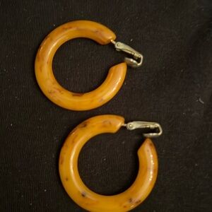 Bakelite hoop earrings the color is rich intermingled with brownish swirls